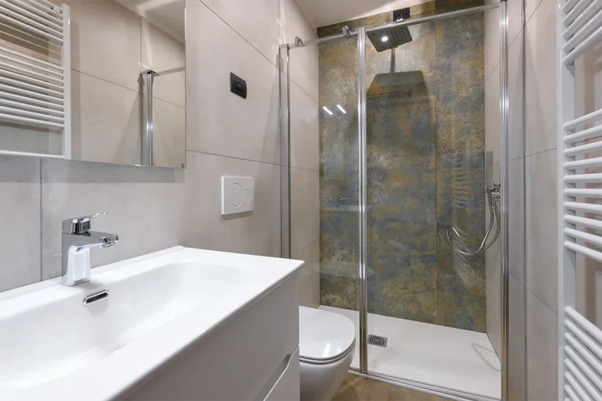 Modern bathroom with glass shower and sink, at Lago di Garda.