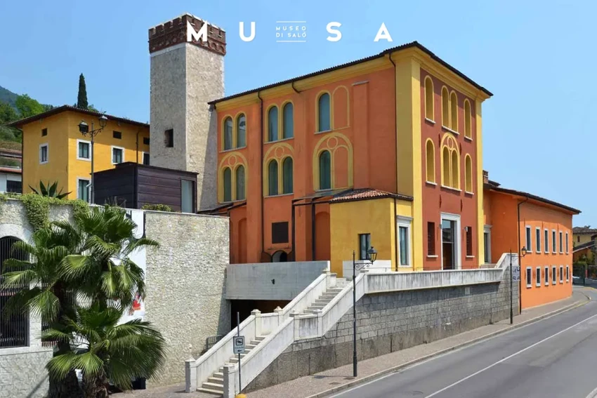 MuSa Museum in Salo, colorful facade with tower and stairs on Lake Garda